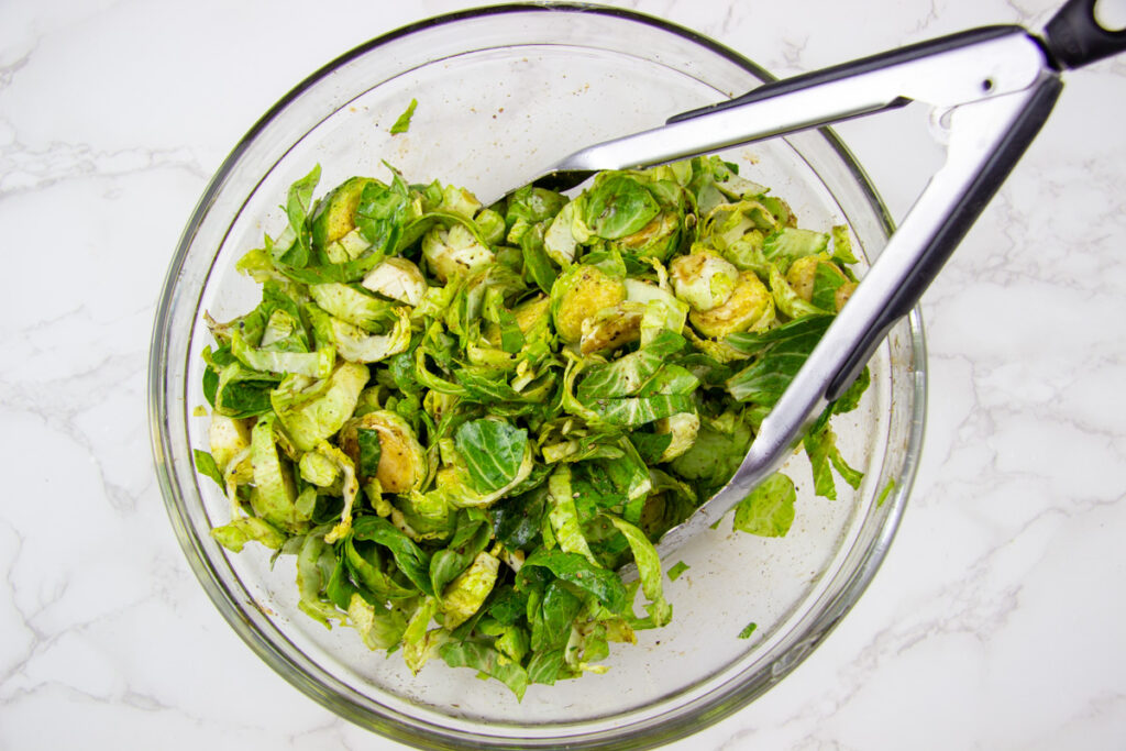 Tossed ingredients in bowl.