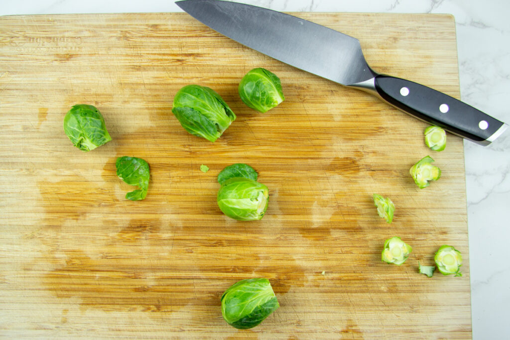 Trimmed sprouts with knife.