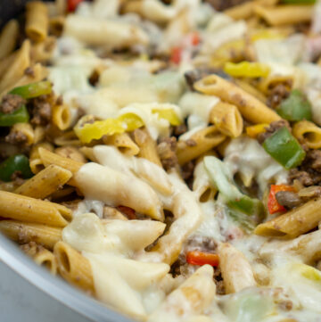 close up of philly cheesesteak pasta in pan