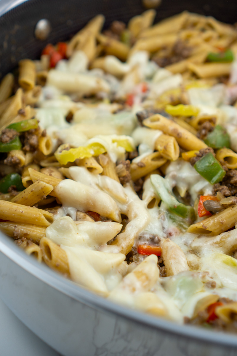 close up of philly cheesesteak pasta in pan