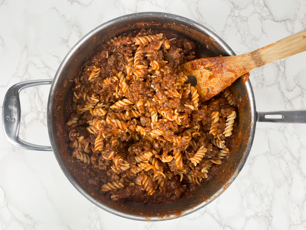 Noodles in pan with ground beef.