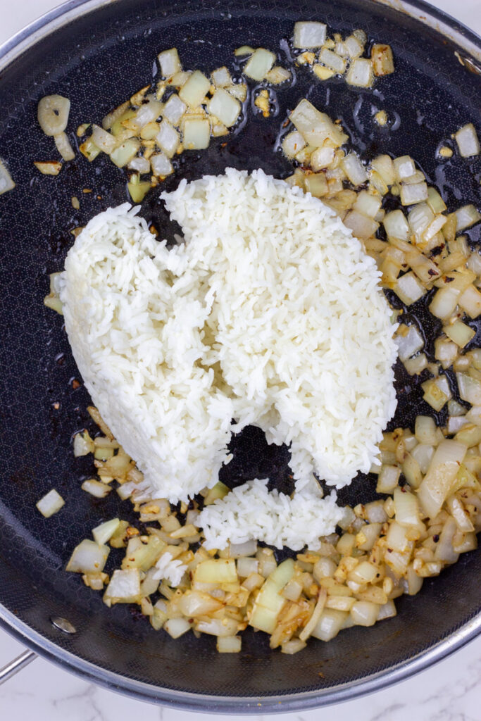 add cooked rice to pan