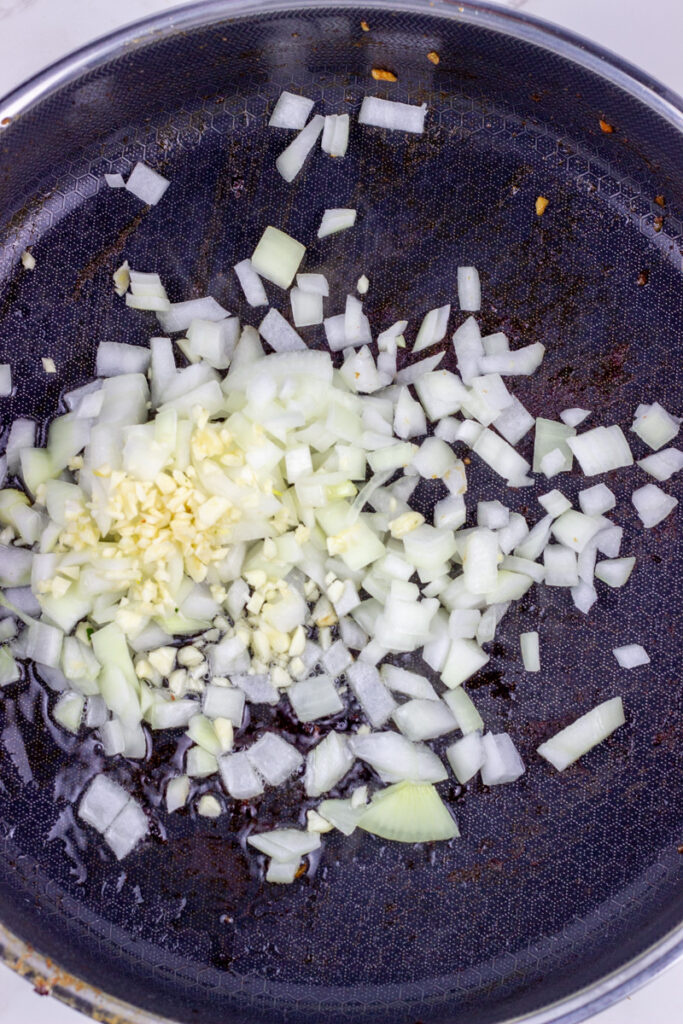 onions and garlic in pan
